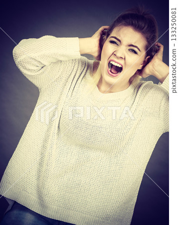 Unhappy woman screaming and yelling in pain Unhappy woman screaming and yelling in pain 133250081