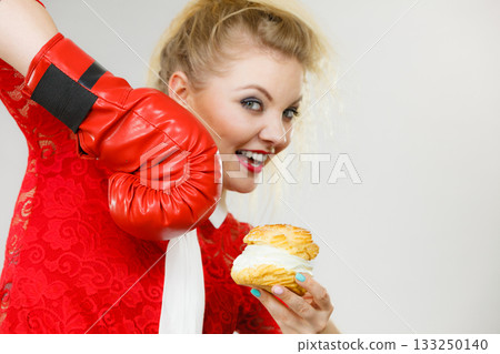 Woman boxing cream cupcake Woman boxing cream cupcake 133250140
