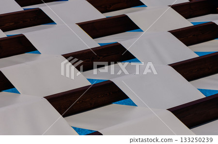 Natural wooden background with striped light and shadow pattern 133250239