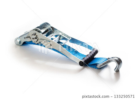 Blue ratchet strap tool with metal buckle and hook, cargo lashing equipment for securing loads, industrial utility for transport and logistics on white background. 133250571