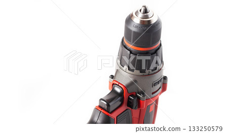 Modern red drill-screwdriver on a white background. Tool for work in industry, isolate Modern red drill-screwdriver on a white background. Tool for work in industry, isolate 133250579
