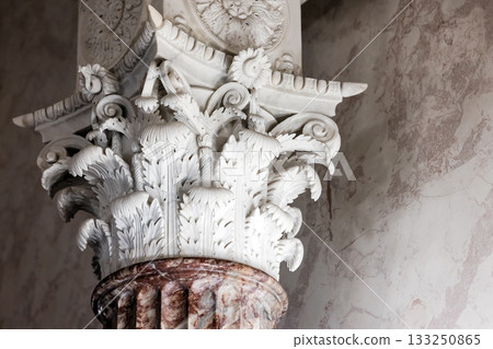 A finely detailed Corinthian capital with acanthus leaves and scroll work 133250865