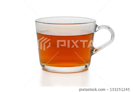 Warm cup of tea resting gracefully on a table, inviting moments of relaxation and comfort 133251245