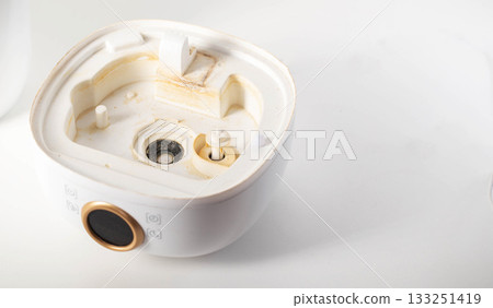 Unpleasant smell, rust and scale from water in the humidifier, white background, close-up 133251419