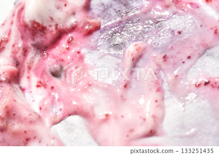 close up of swirled pink yogurt and berry mixture with visible berry seeds close up of swirled pink yogurt and berry mixture with visible berry seeds 133251435