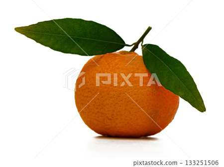 Fresh orange with green leaves resting on a bright white surface, showcasing vibrant colors and natural beauty 133251506