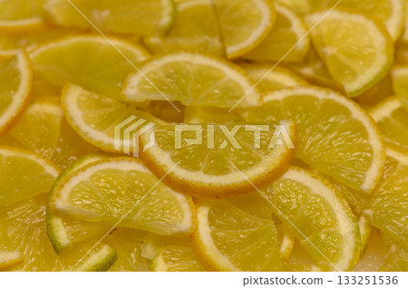 Delightful citrus slices laid out on a surface, showcasing a vibrant yellow feast for the senses 133251536