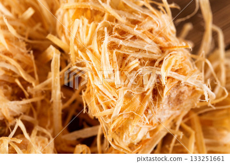 Wooden rolls for starting a fire, stove, barbecue, soaked in paraffin, macro, background Wooden rolls for starting a fire, stove, barbecue, soaked in paraffin, macro, background 133251661