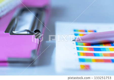 Binders and graphs on the table 133251753