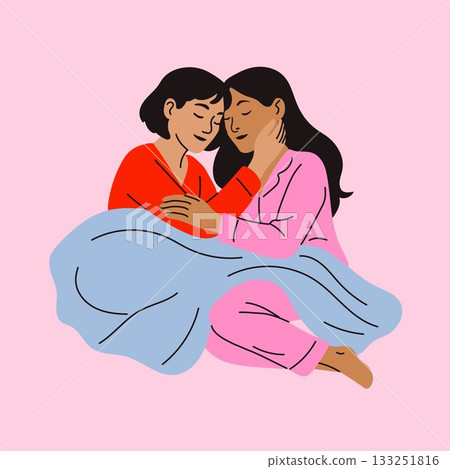 Intimate Moment Between Two Women in Pajamas with Blanket 133251816