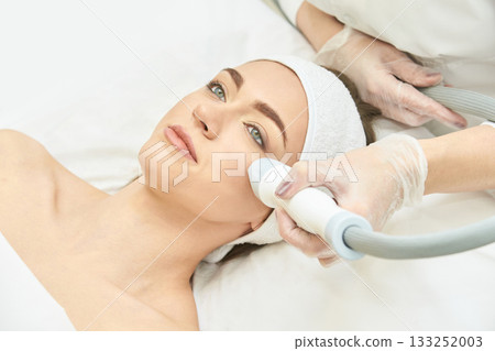 Female caucasian adult receiving facial skin treatment in spa setting Female caucasian adult receiving facial skin treatment in spa setting 133252003