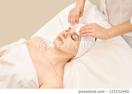 Young caucasian female receiving skincare treatment at spa with relaxing Young caucasian female receiving skincare treatment at spa with relaxing 133252040