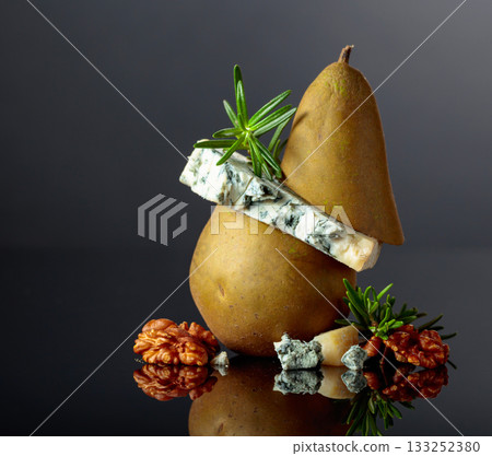 Blue cheese with pear, walnuts, and rosemary. 133252380