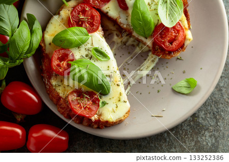 Hot open sandwiches with mozzarella, tomatoes and basil. Hot open sandwiches with mozzarella, tomatoes and basil. 133252386