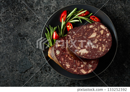 Spanish black pudding or blood sausage accompanied by rosemary and red pepper. 133252392
