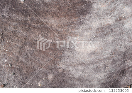 rock with natural patina stain caused by rain water 133253005