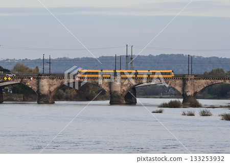 Pearl of the Elbe River: A tram crossing the Augustus Bridge in Dresden's Old Town, Germany Pearl of the Elbe River: A tram crossing the Augustus Bridge in Dresden's Old Town, Germany 133253932