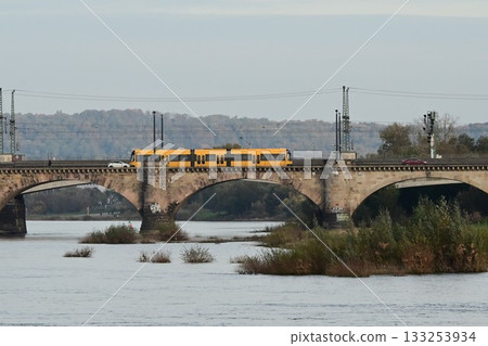 Pearl of the Elbe River: A tram crossing the Augustus Bridge in Dresden's Old Town, Germany Pearl of the Elbe River: A tram crossing the Augustus Bridge in Dresden's Old Town, Germany 133253934