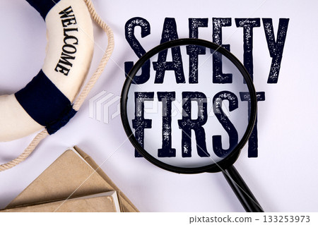 Magnifying Glass Focusing on Text Safety First with Lifebuoy Symbol Representing Caution and Magnifying Glass Focusing on Text Safety First with Lifebuoy Symbol Representing Caution and 133253973