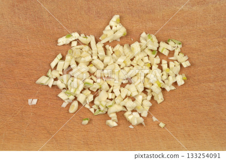Chopped Garlic on Cutting Board 133254091