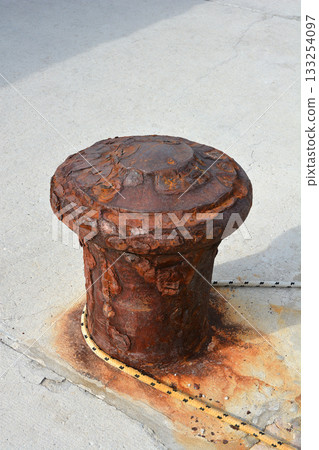 Rusted Mooring Bollard on Pier 133254097