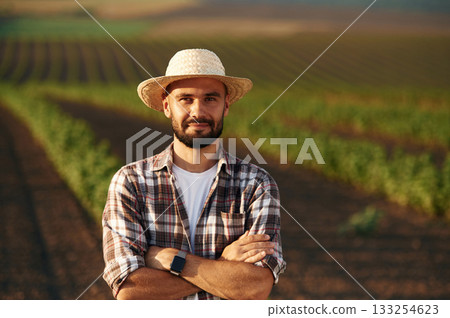 Farmer is on the agricultural field 133254623