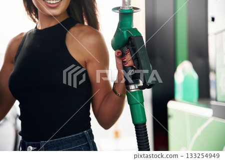 Young woman on the gas station 133254949