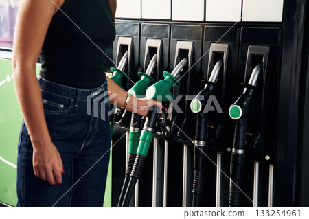 Young woman on the gas station Young woman on the gas station 133254961