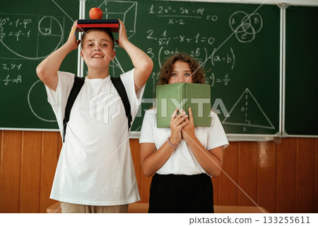 Having fun on a break time. Pupils, kids in the classroom together Having fun on a break time. Pupils, kids in the classroom together 133255611