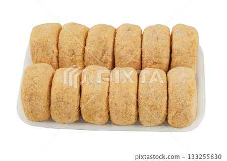 Frozen cutlets. Homemade semi-finished products on white boarde on a white background. Preparations of homemade patties. Frozen cutlets. Homemade semi-finished products on white boarde on a white background. Preparations of homemade patties. 133255830