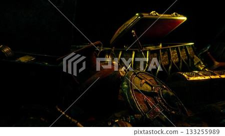 In a shadowy room, an open treasure chest displays gleaming artifacts. Ancient pots, shields, and ornate items evoke tales of lost civilizations. A sense of mystery fills the air. 133255989
