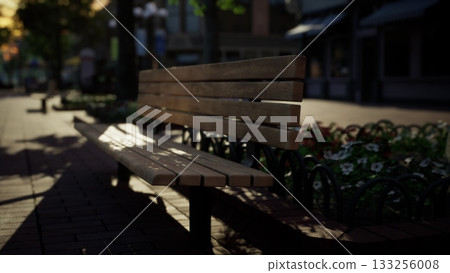 A warm evening light filters through trees, casting playful shadows on a wooden bench. Nearby, colorful flowers bloom, adding life to this peaceful corner of a bustling town. A warm evening light filters through trees, casting playful shadows on a wooden bench. Nearby, colorful flowers bloom, adding life to this peaceful corner of a bustling town. 133256008
