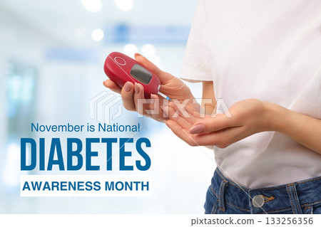 Person holds a diabetes meter with focus on health awareness 133256356