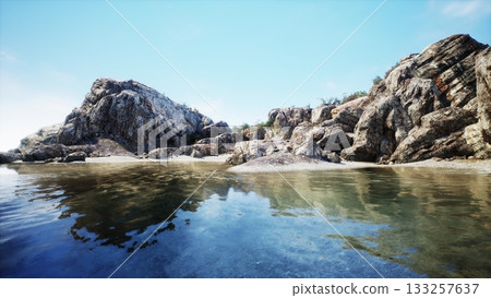 A tranquil coastal scene features clear water reflecting rugged cliffs and a vibrant blue sky. The serene landscape invites a sense of peace and explores natural beauty in this idyllic location. A tranquil coastal scene features clear water reflecting rugged cliffs and a vibrant blue sky. The serene landscape invites a sense of peace and explores natural beauty in this idyllic location. 133257637