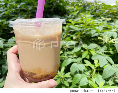 Black sugar milk tea with warabi mochi: A tapioca-style drink with chewy warabi mochi. Black sugar milk tea with warabi mochi: A tapioca-style drink with chewy warabi mochi. 133257671
