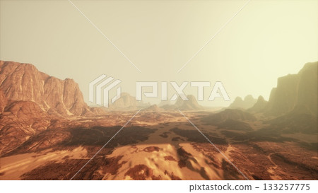 A breathtaking desert landscape features rocky formations stretching towards the horizon. The warm hues of the sky create a serene atmosphere as the sun begins to set. A breathtaking desert landscape features rocky formations stretching towards the horizon. The warm hues of the sky create a serene atmosphere as the sun begins to set. 133257775