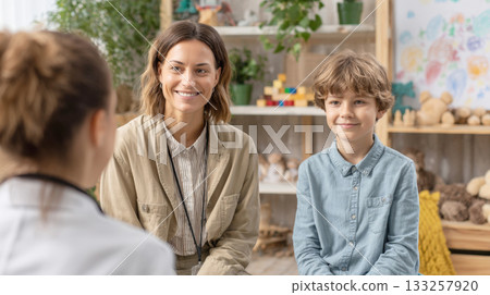Encouraging Mother, Son Attending Consultation with Therapist, Doctor, Comfortable Office, Symbolizing Child Psychology, Developmental Health, Supportive Family Communication for Mental Wellness 133257920