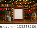 Cozy holiday scene with empty frame, coffee cup, and festive decor in a library setting 133258180
