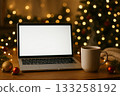 Cozy workspace with laptop and hot drink during holiday season 133258192