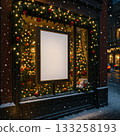 Festive winter window display with lights and ornaments in a city street at night 133258193