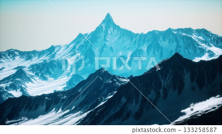 Towering peaks create a stunning backdrop in this serene mountain scene, showcasing vibrant shades of blue against a bright sky. Snow capped surfaces reflect sunlight beautifully. 133258587