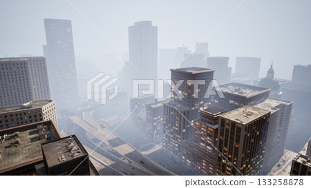 Thick mist blankets the urban landscape, obscuring tall buildings and creating an ethereal atmosphere. Roads wind through the city, hinting at the hustle and bustle beneath the fog. Thick mist blankets the urban landscape, obscuring tall buildings and creating an ethereal atmosphere. Roads wind through the city, hinting at the hustle and bustle beneath the fog. 133258878