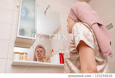 Woman brushing tooth. Morning routine and personal hygiene in bathroom. Woman brushing tooth. Morning routine and personal hygiene in bathroom. 133259220