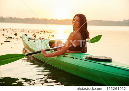 Leisure, wellness conception. Young woman is with the sup board on the lake Leisure, wellness conception. Young woman is with the sup board on the lake 133261912