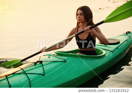 Learning process, joy. Young woman is with the sup board on the lake 133261922
