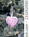 Christmas tree with pink fluffy soft heart in bokeh light decoration holiday decorations New year concept merry Christmas background greeting card 133262090