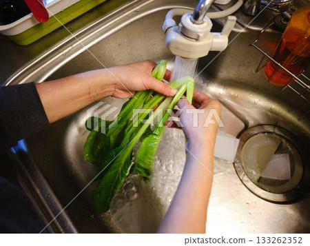 Kitchen cooking vegetables cutting woman hand tags Kitchen cooking vegetables cutting woman hand tags 133262352
