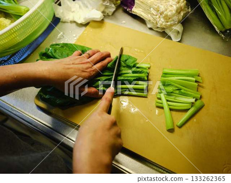 Kitchen cooking vegetables cutting woman hand tags Kitchen cooking vegetables cutting woman hand tags 133262365