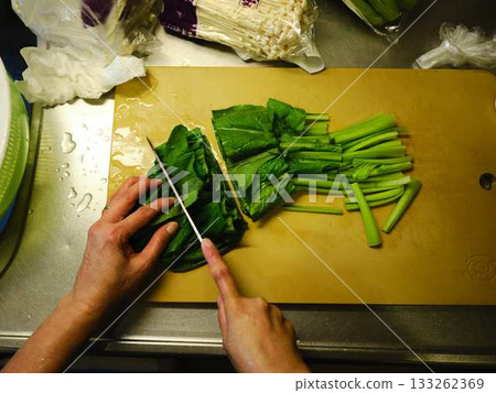 Kitchen cooking vegetables cutting woman hand tags Kitchen cooking vegetables cutting woman hand tags 133262369