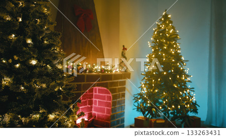 Christmas Trees Near the Fireplace in the Room Illuminated Cozy Atmosphere Christmas Trees Near the Fireplace in the Room Illuminated Cozy Atmosphere 133263431